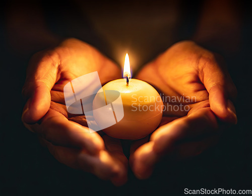 Image of small candle burning held in hands on black background generativ