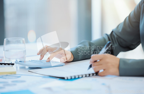 Image of Hands, finance calculator and woman writing on kpi paper data, company growth and business review documents. Zoom on financial planning accounting, marketing budget or office investment stock worker