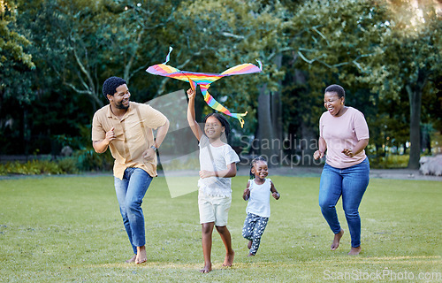 Image of Black family, kite and outdoor fun with parents and children having fun and playing outside at a park in nature. Energy, love and running while being active and bonding with man, woman and kids