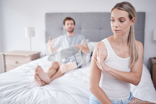 Image of Mental health, stress and a couple fight in bedroom in the morning due to bad marriage. Toxic relationship, argument and the risk of divorce after a man and woman fighting in the bed in family home.