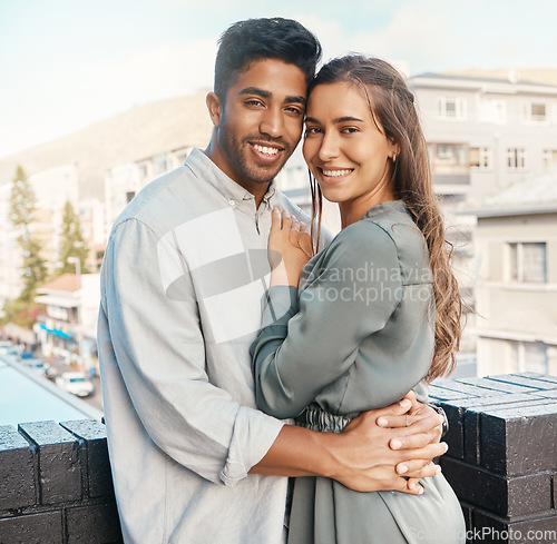 Image of Love, couple and travel with a man and woman tourist hugging on a balcony in a foreign city together. Romance, dating and diversity with a young male and female on honeymoon overseas or abroad