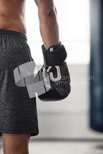 Image of Boxer, fighter glove and hand close up at sports club or gym for training with equipment for fist. Athlete sportswear for protection for mma and boxing fight or workout with safety gear.