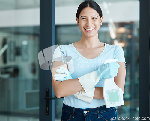 Image of Portrait of a woman, cleaner or maid with gloves and detergent ready to clean the office building. Happy, smile and proud girl standing with spray bottle while cleaning or disinfecting the workplace.