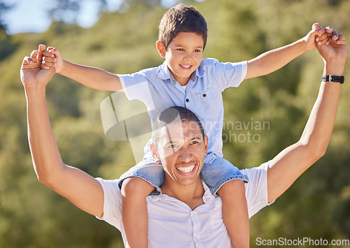 Image of Happy dad, child and family nature walk of a kid on father shoulders with a smile in the summer sun. Happiness, fun and outdoors experience of a man and kid walking and hiking in nature together