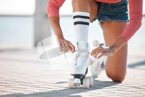 Image of Skate, shoes and woman sport fitness athlete on a beach boardwalk about to start skating. Sports, workout and training of a healthy female on a summer day working on a skater exercise for cardio