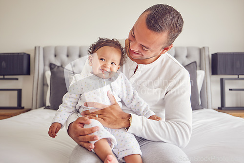 Image of Happy baby and father relax in a bedroom portrait for love, support and child care. Excited, happiness of dad holding newborn girl, child or kid bonding together for healthy growth development