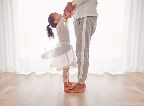 Image of Family, dance and daughter on dad feet together on floor of interior for happiness, childhood and bonding. Care, love and youth with father dancing with child, walking on foot step for support