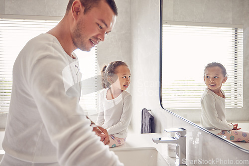 Image of Bathroom, man and child smile in morning before work and school. Cleaning, ready for the day and a father and daughter in a sunny bath room of family home. Happy kid looking at reflection in mirror.