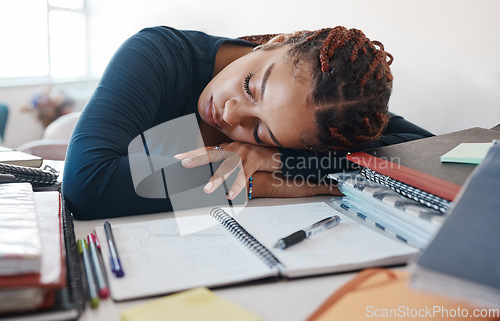 Image of Burnout, sleeping student at desk with books while studying, reading or university education knowledge in room. Tired fatigue gen z black woman in home office with notebook for scholarship learning