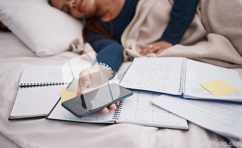 Image of Phone, books and sleeping woman student tired from learning, studying and education exam paper in bed. University or college girl rest with mobile smartphone for online research paperwork document