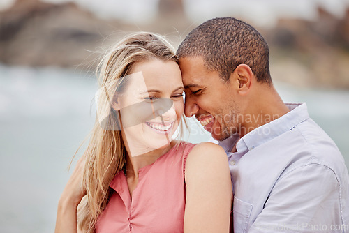 Image of Love, happy and hug with couple together for romance, relationship and lifestyle on beach holiday trip. Happiness, care and support with man and woman in embrace on summer vacation date by the sea