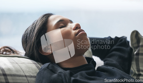 Image of Relax, tired and rest with woman on sofa in living room for stress management, mental health and fatigue. Exhausted, sleeping and peace with young female lying on couch for calm, relaxation and nap
