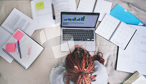 Image of College education and study laptop on bed with school books and sticky notes in home. University student studying graph, analytics and reading digital learning notes for exam preparation.