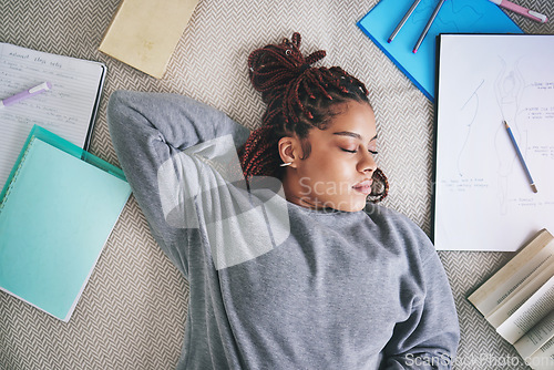 Image of Student, sleeping and burnout with study books on house living room, home interior and bedroom floor. Top view of black woman, fashion designer or art university person tired after education learning