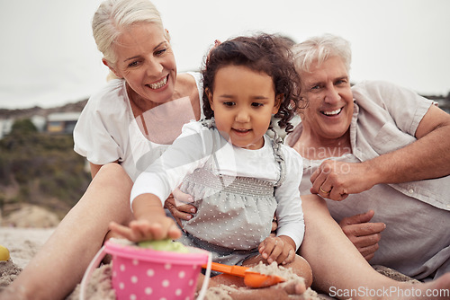 Image of Senior family with girl playing in beach sand together for holiday, outdoor wellness and child development. Grandmother, grandparents care and love for baby or people relax on vacation or retirement