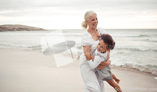 Image of Beach, fun and grandmother playing with child for holiday, bonding and care together by the ocean. Summer, vacation and happy relationship with young foster girl and grandma embracing by the sea