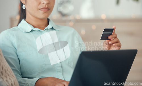 Image of Credit card, online shopping and banking online on a laptop at home. Woman with card and computer with convenient, easy and quick way to bank and shop. Bank card, remote and electronic services