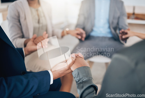 Image of Business people holding hands in prayer, community trust and support in therapy, workshop and communication for mental health. Depression, anxiety or stress with employees or counseling in circle