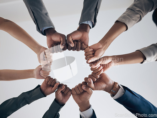 Image of Team, motivation and support with hands fist bump of corporate partnership office workers. Work community, goal success and collaboration hand sign of business employee group teamwork together