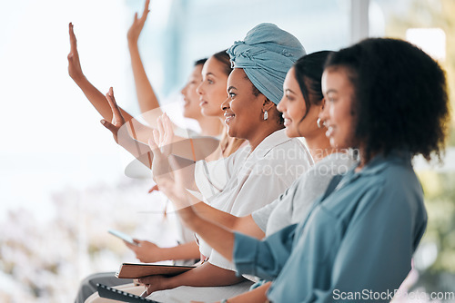 Image of Business women question hands raised in diversity, inclusion and empowerment workshop training or team meeting. Group of people or audience in a convention seminar discussion with development ideas