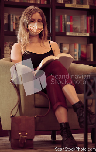 Image of Woman reading covid research book in library with face mask, silent young university student reads classic literature and learning knowledge in old study during covid 19 pandemic lockdown