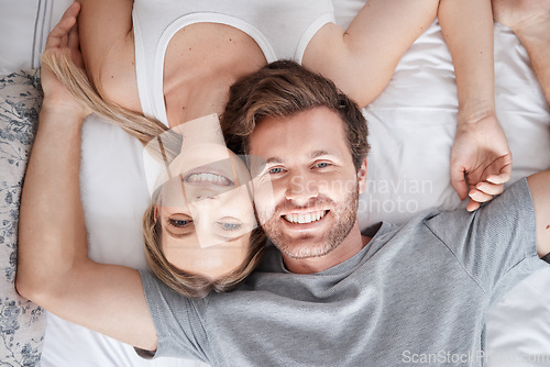 Image of Couple portrait, above bed and smile for love marriage in bedroom, happy with support and content with sleep. Top view face of calm man and woman in happiness together after sleeping in apartment