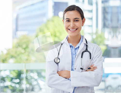 Image of Healthcare, doctor or nurse woman with stethoscope in hospital, bokeh and happy with smile. Health, trust and mission professional medical expert or worker with wellness motivation and vision