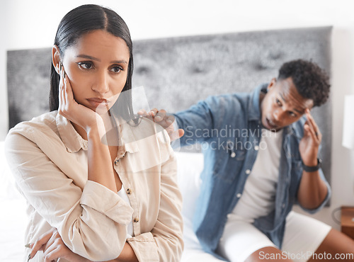 Image of Couple fighting, sad woman ignore man who try stop conflict or divorce in home. Angry lady in bedroom, guy touch with hand wants communication or conversation about problem in house