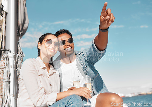 Image of Couple, champagne and pointing on luxury yacht for summer holiday, anniversary celebration and travel in Monaco. Smile, happy or love bond man and woman on ocean or sea water boat for relax honeymoon