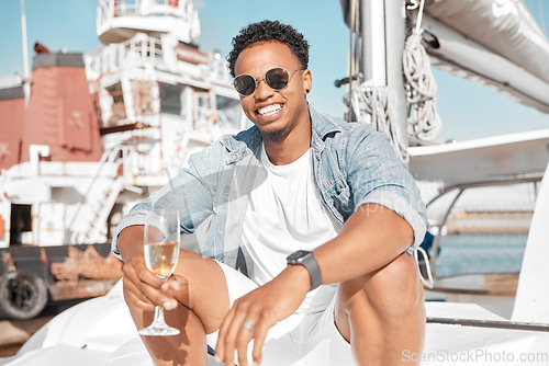 Image of Luxury, wine glass and man on a yacht for holiday vacation on the ocean or sea with sunglasses. Gen z entrepreneur portrait enjoying his wealth with champagne glass on cruise boat travel in summer