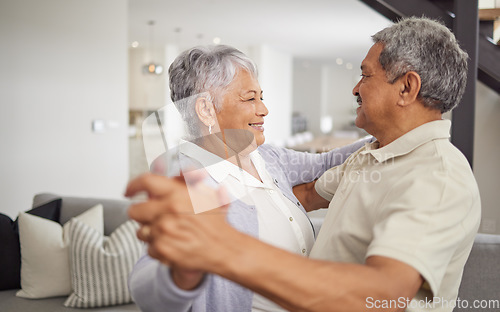 Image of Love, dancing and happiness with a senior couple being playful and romantic while celebrating their anniversary or retirement at home. Happy man and woman bonding together in a healthy relationship