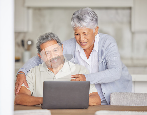 Image of Retirement, laptop and senior couple on the internet reading an email or news via a social network website. Happy elderly woman with a relaxed husband streaming or browsing online at home