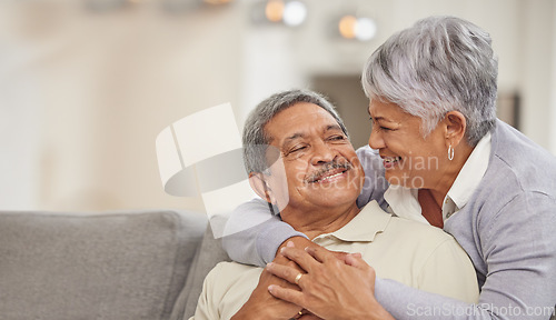 Image of Relax, retirement and senior Mexico couple on sofa at home enjoying free time with smile, hug and love. Happy, comfortable and relationship of elderly man and woman on couch in living room together