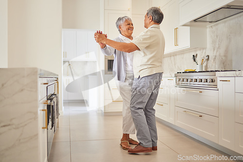 Image of Senior couple dance, kitchen and elderly love of people spending quality time together at home. Happy retirement of a woman and man from Mexico dancing in their house with a smile and happiness