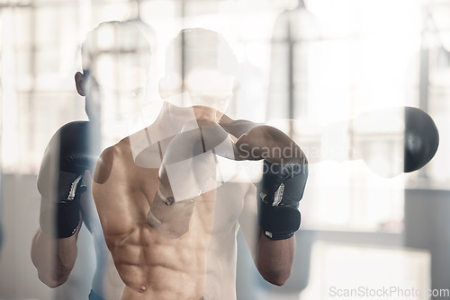 Image of Motion blur of boxer man in gym, training for fitness and health with boxing gloves. Strong young athlete, in wellness center or sport club, to workout, for box or mma fight in portrait