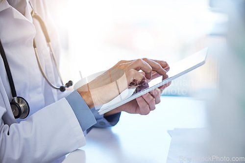 Image of Doctor tablet, hospital planning and consulting with people on the internet, reading clinic schedule and communication online at work. Healthcare nurse typing on technology while working as a medic