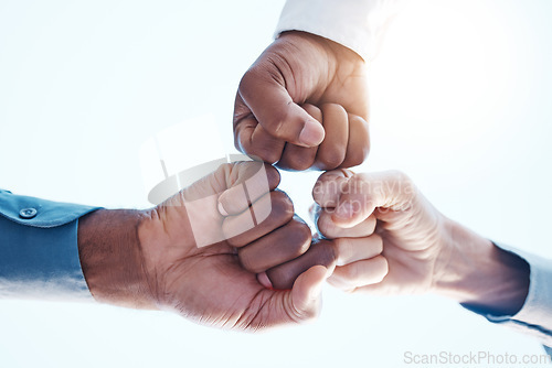 Image of Fist bump, group support and team success in meeting at work, celebration of corporate win and team building in office. Hands of business employees giving motivation and agreement while planning