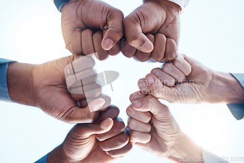 Image of Diversity, fist bump and success of a corporate team collaboration winning a company business deal. Group, celebration and hands in unity at a business meeting for motivation and achievement.