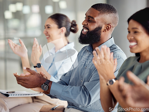 Image of Applause, motivation and success with a business team clapping during a workshop for learning, coaching and development. Collaboration, teamwork and goal with a crowd in celebration of an achievement