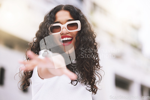 Image of Designer sunglasses, luxury clothes and model being creative against city background, smile for summer and happy on weekend in town. Portrait of cool and trendy girl posing in fashion downtown