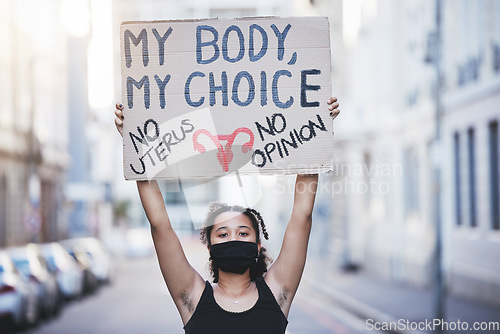 Image of Freedom, protest and abortion with a woman and a poster, fighting for human rights and gender equality. Justice, change and banner in the hands of a young female marching for social justice