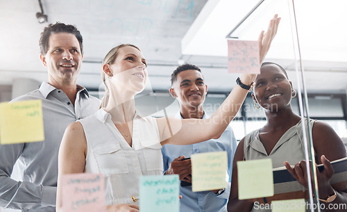 Image of Idea wall, post it and team conversation with business strategy brainstorm notes in glass room. Vision board goal planning in professional corporate meeting discussion together at office.