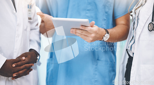 Image of Teamwork, healthcare and doctors planning on digital tablet, sharing advice and checking online schedule in a hospital. Communication, strategy and innovation closeup of health experts sharing vision