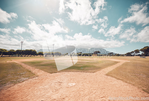 Image of Empty baseball field, stadium or sport softball park for competition, training or tournament match. Sports, ball game or exercise, recreation or grass lawn nature area with pitch circle blue sky view