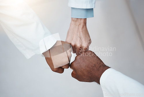 Image of Trust, teamwork and hand fist together in solidarity with medical ethics in the workplace. Support of diverse professional healthcare work people in organization with respect and loyalty.