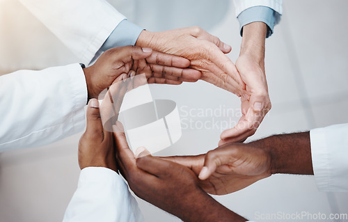 Image of Healthcare, teamwork and doctors hands in a circle for support, trust and diversity. Connection, collaboration and partnership in medicine. Success, hope and unity, group of medical workers together.