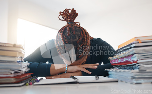 Image of Stress, study and books with black woman sleeping at desk from burnout, tired or depression. Education, learning and knowledge with student rest at homework notebook with headache, anxiety or mistake