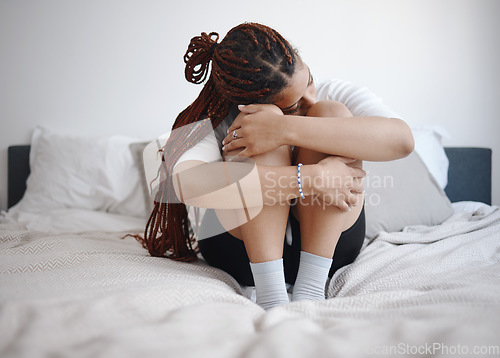 Image of Depression, anxiety and sad woman on bed with a mental healthy problem. Suicide, depressed or insomnia and young girl crying, heartbroken or stress in her bedroom for fail, mistake or fear