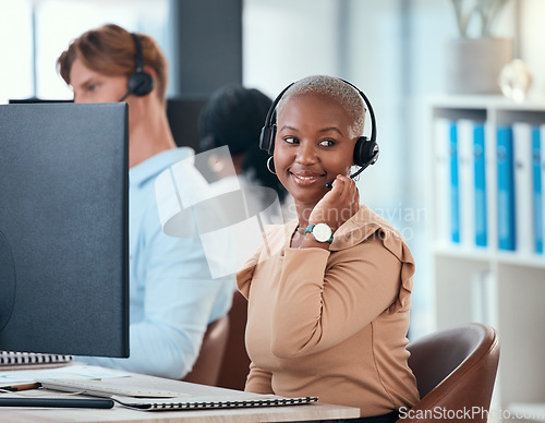 Image of Black woman working in call center, customer service or online help desk office on conversation with client or customer. Communication, consulting and telemarketing consultant giving a sales pitch