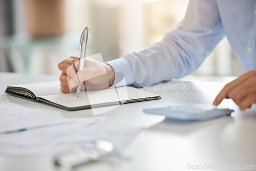 Image of Accountant, notebook and audit budget with calculator while analyzing paperwork and doing finance planning in home. Hands of businessman writing doing tax and accounting report in book on a table